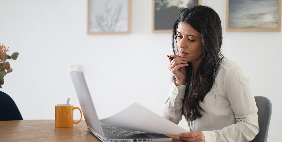 A lender working on a laptop